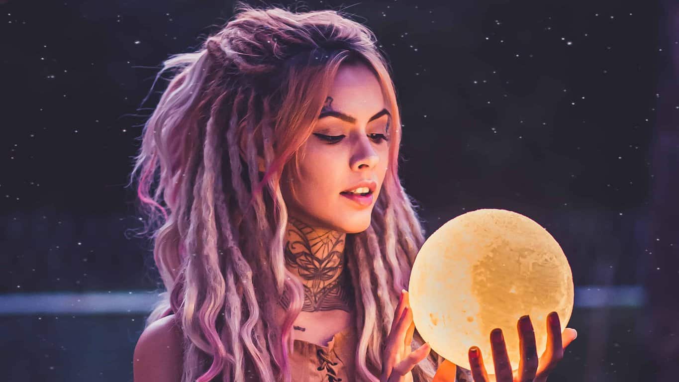 woman holding 3d moon lamp prediction