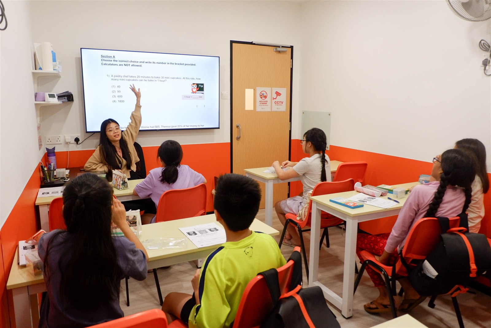 Teacher and students during a lesson at AGrader Learning Centre
